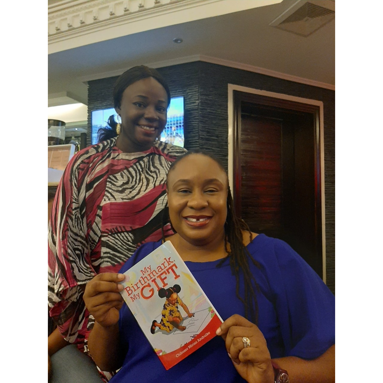 Me and Chioma Ifeanyi-Eze (CEO of AccountingHub) and a copy of my book